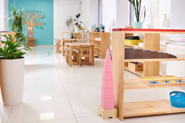Light class in Montessori kindergarten. The pink tower is in the foreground. nobody stock photo