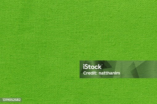 istock Light green cotton fabric texture background, seamless pattern of natural textile. 1319052582
