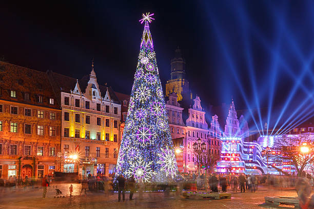 Light laser show on Market Square, Wroclaw, Poland Christmas tree and light laser show on Market Square at christmas night in Wroclaw, Poland wroclaw stock pictures, royalty-free photos & images
