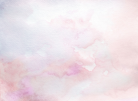 Abstract wet pink and purple watercolor background on white watercolor paper. My own work.