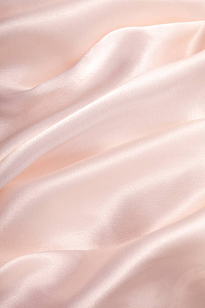 Light pink satin sheet stock photo