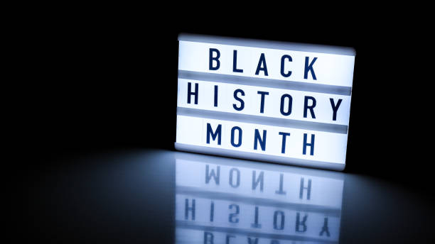 Lightbox with text BLACK HISTORY MONTH on dark black background with mirror reflection. Message historical event Lightbox with text BLACK HISTORY MONTH on dark black background with mirror reflection. Message historical event. Light black history month stock pictures, royalty-free photos & images