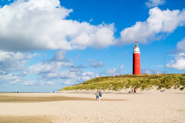 Lighthouse and beach of De Cocksdorp on Texel island, Netherlands stock photo