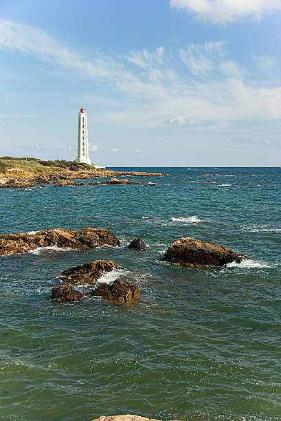 Lighthouse at Atlantic shore stock photo