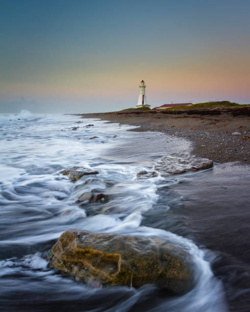 Lighthouse at Sunrise stock photo