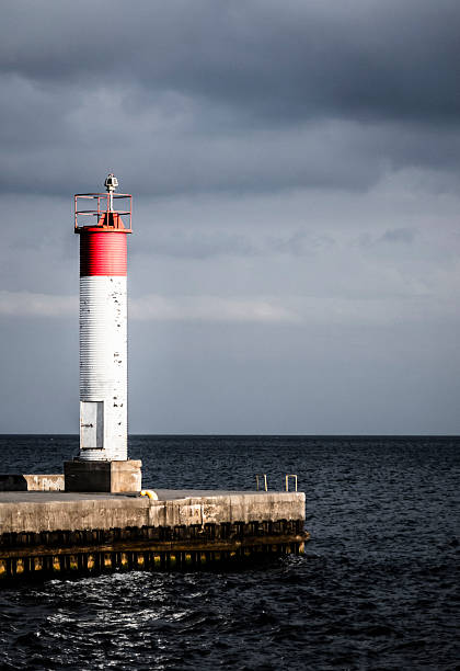 Lighthouse at the end of a Pier stock photo