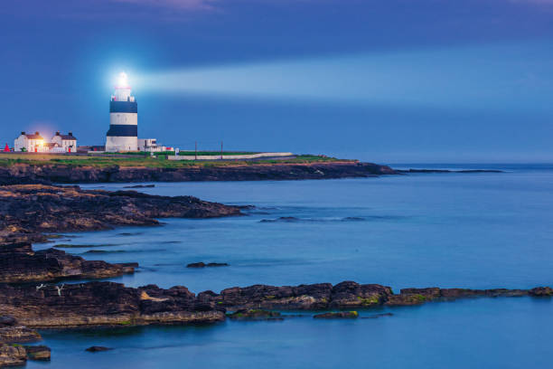 Lighthouse in the night stock photo