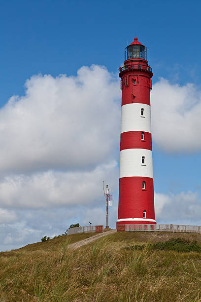 lighthouse on a dune stock photo