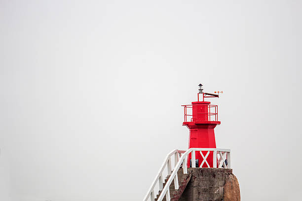 lighthouse on island stock photo