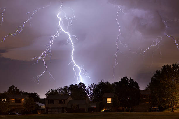 Lightning strike over Denver homes stock photo