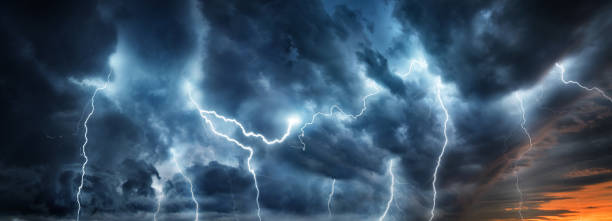 Lightning thunderstorm flash over the night sky. stock photo