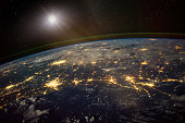 istock Lights from areas in the Gulf Coast states of Texas, Louisiana, Mississippi and Alabama, satellite view, The elements of this image furnished by NASA. 1060545914