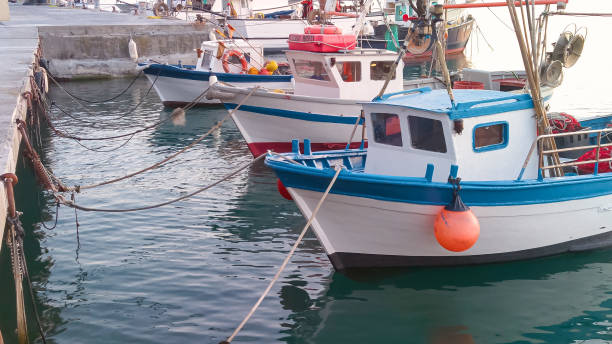 Ligurian boat moored in the ancient port of Imperia Oneglia fishing boats moored in the ancient port of Imperia Oneglia in Liguria - Italy anchor point stock pictures, royalty-free photos & images