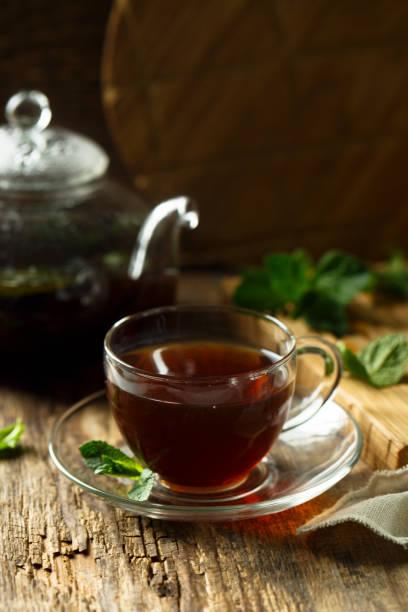 Like tea Freshly made black tea with mint bengali sweets stock pictures, royalty-free photos & images
