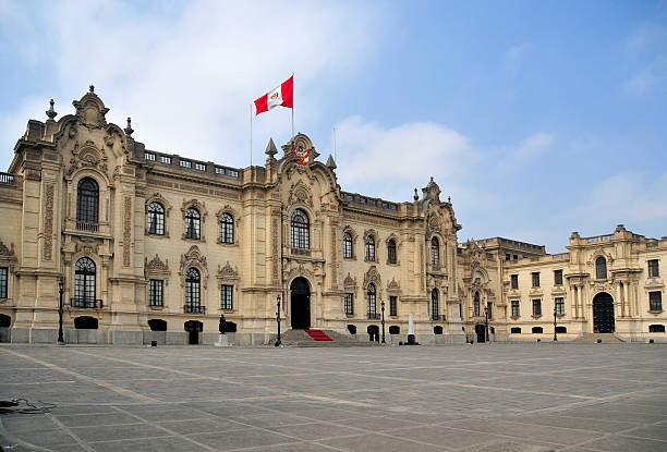 Lima, Peru: Government Palace - Residence of the President - known as House of Pizarro - Palacio de Gobierno - Plaza de Armas - Historic Centre of Lima, Unesco World Heritage Site, sky, copy space - photo by M.Torres