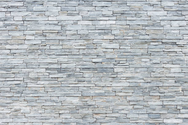 limestone wall in small rectangular blocks for background A limestone wall in small rectangular blocks for background limestone stock pictures, royalty-free photos & images