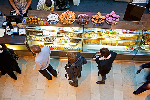 Lining up at cafe' with tasty pastry for a snack. stock photo