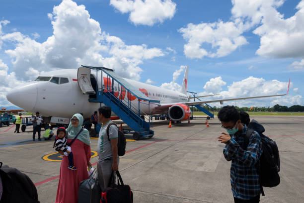 Lion Air and passengers at airport in Banjarmasin, Indonesia stock photo