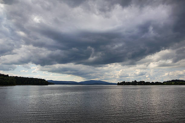 Lipno lake in overcast weather, Czech Republic. View of Lipno lake in overcast weather, Czech Republic. altostratus stock pictures, royalty-free photos & images