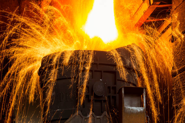 Liquid iron from ladle in the steelworks stock photo