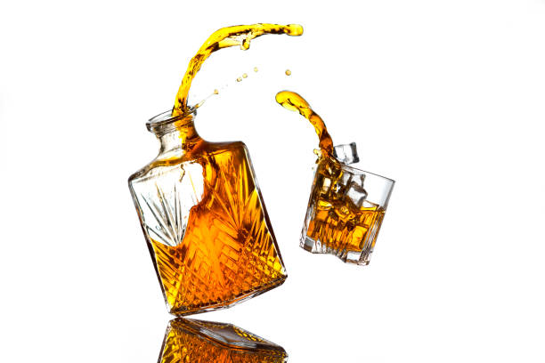 Liquor bottle and glass stock photo