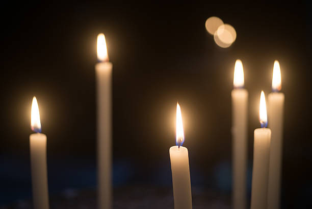Lit candles stock photo