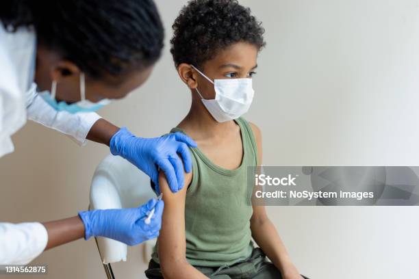 Little African-American boy COVID-19 vaccination