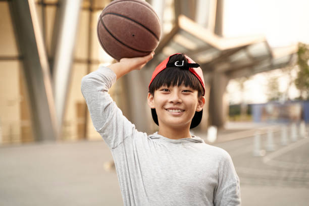 little asian basketball player stock photo
