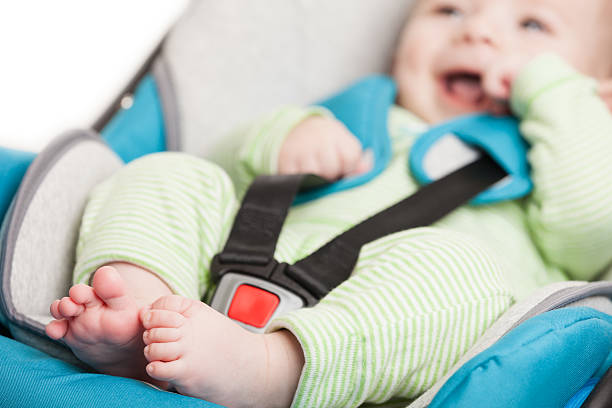 Little baby child in safety car seat stock photo