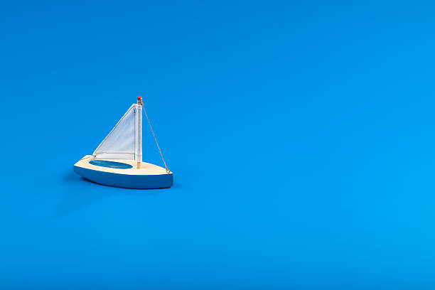 Little blue toy boat stock photo