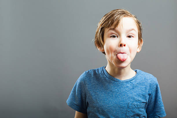 Little Boy Expressions - Sticking out Tongue stock photo