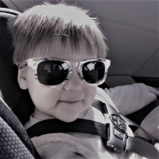 Little Boy in Car Seat stock photo