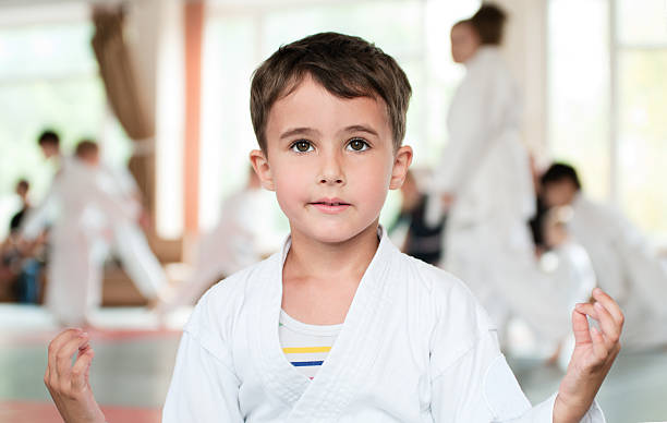 Little boy in kimono meditation before competition stock photo