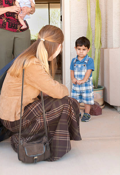 Little Boy Sad About Saying Bye to Mom stock photo