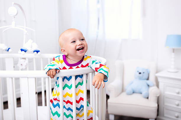 Baby Standing In Cot Stock Photos, Pictures & Royalty-Free Images - iStock