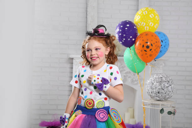 Little clown with balloons. stock photo