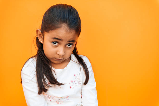Little Girl Facial Expressions Portrait of a sad little girl shy photos stock pictures, royalty-free photos & images