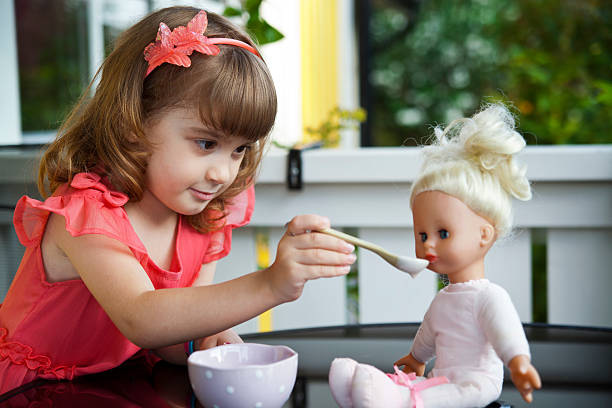 74 Little Girl Feeding Baby Doll Stock Photos, Pictures & Royalty-Free Images - iStock