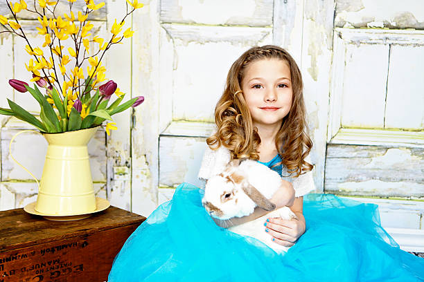 little girl holding rabbit - dwarf rabbit bildbanksfoton och bilder