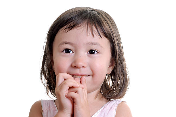 Little Girl Looking Forward in Anticipation stock photo