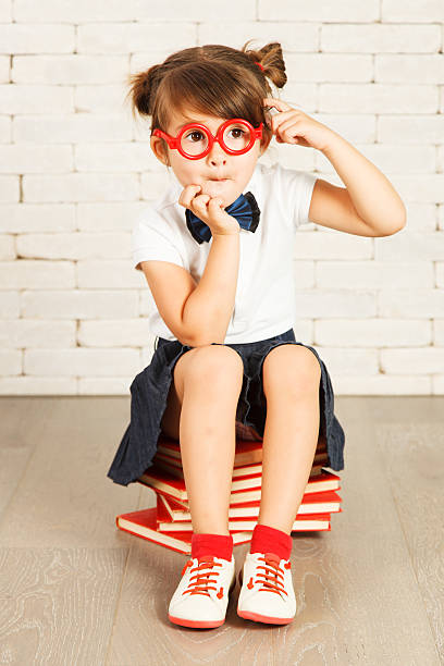 Little girl nerd stock photo