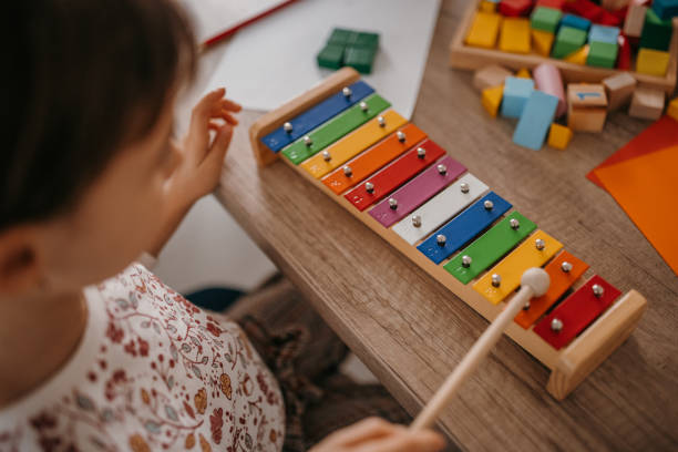 Little girl playing xylophone stock photo