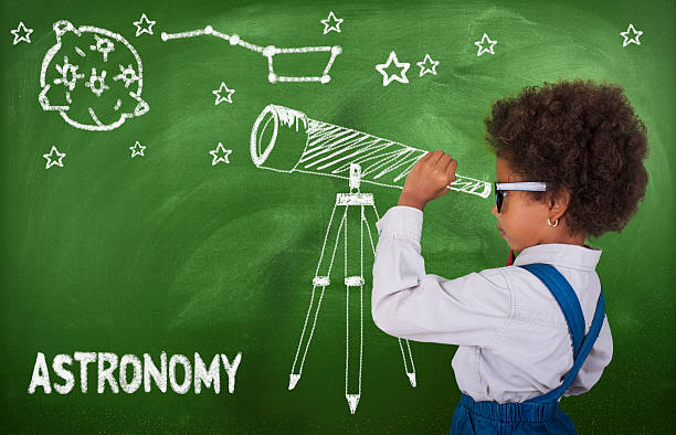Little girl using his imagination to look at stars astronomy, blackboard, school, classroom, telescope astronomy telescope stock pictures, royalty-free photos & images