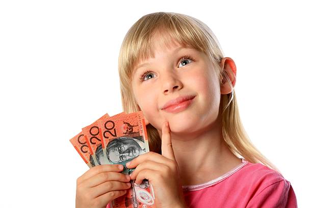 Little Girl with Australian 20 dollar notes money cash stock photo