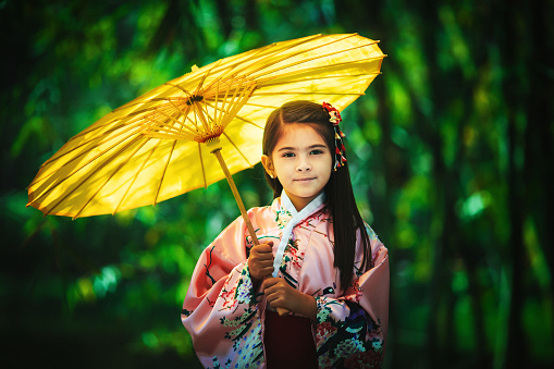 Little girl with japanese heritage wearing kimono