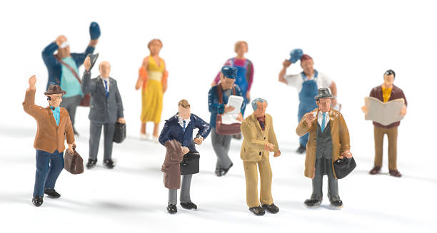 little people on white background little people standing arround figurine stock pictures, royalty-free photos & images