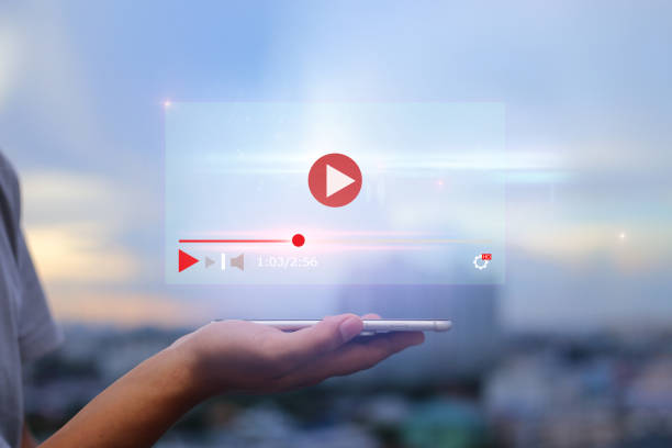 live video content online streaming marketing concept. Hands holding mobile phone on blurred urban city as background live streaming stock pictures, royalty-free photos & images