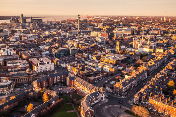Liverpool city aerial panorama view during sunset Liverpool city aerial panorama view during sunset taken in cathedral, Merseyside, United Kingdom liverpool docks and harbour building stock pictures, royalty-free photos & images