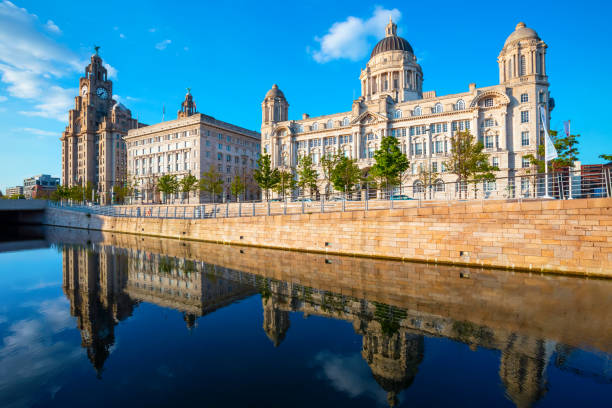 Liverpool Pier Head with the Royal Liver Building, Cunard Building and Port of Liverpool Building Liverpool, UK - May 18 2018: Liverpool Pier Head with the Royal Liver Building, Cunard Building and Port of Liverpool Building part of the Liverpool Maritime Mercantile City UNESCO World Heritage Site liverpool docks and harbour building stock pictures, royalty-free photos & images