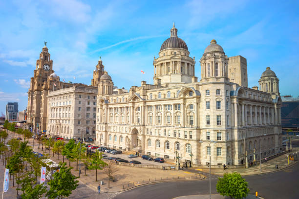 Liverpool Pier Head with the Royal Liver Building, Cunard Building and Port of Liverpool Building Liverpool, UK - May 17 2018: Liverpool Pier Head with the Royal Liver Building, Cunard Building and Port of Liverpool Building part of the Liverpool Maritime Mercantile City UNESCO World Heritage Site liverpool docks and harbour building stock pictures, royalty-free photos & images